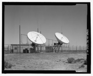 Satellite dishes in desert.