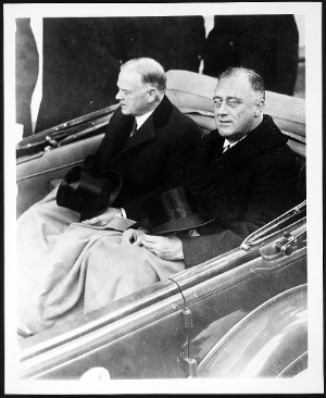 FDR and Hoover w tophats riding to inauguration. 1933.