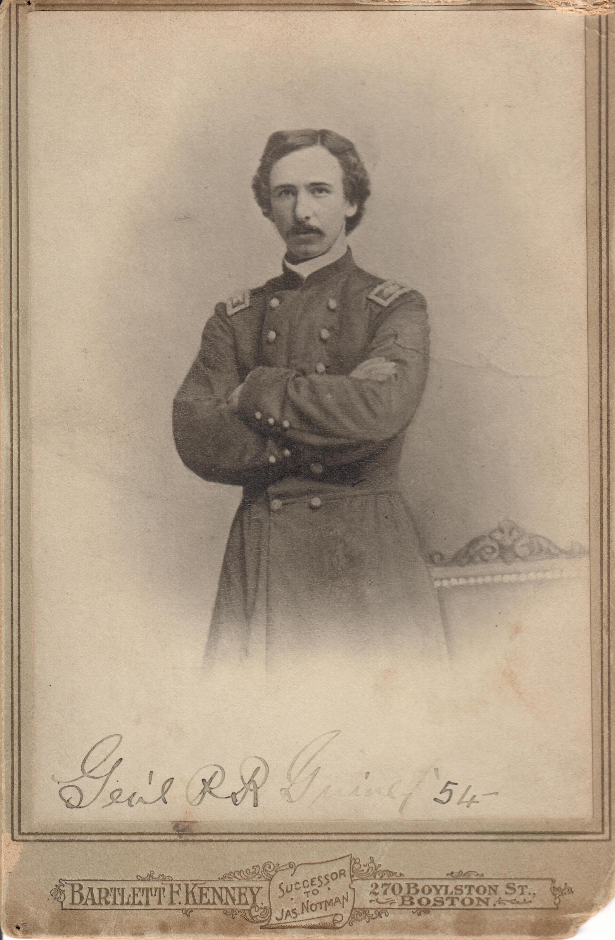 A Union officer poses, arms crossed, in his uniform and mustache. Gen’l P.R. Guiney 54 is handwritten on the card. 