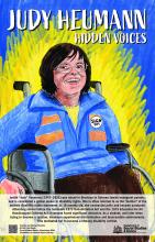A drawing of a white woman with shoulder-length brown hair and glasses, wearing a blue jumper with a button on the left side of her chest reads “Sign 504.” She is in a wheelchair and smiling.  