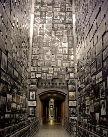 Photo of the wall of remembrance - hundreds of photos of people killed in the Holocaust